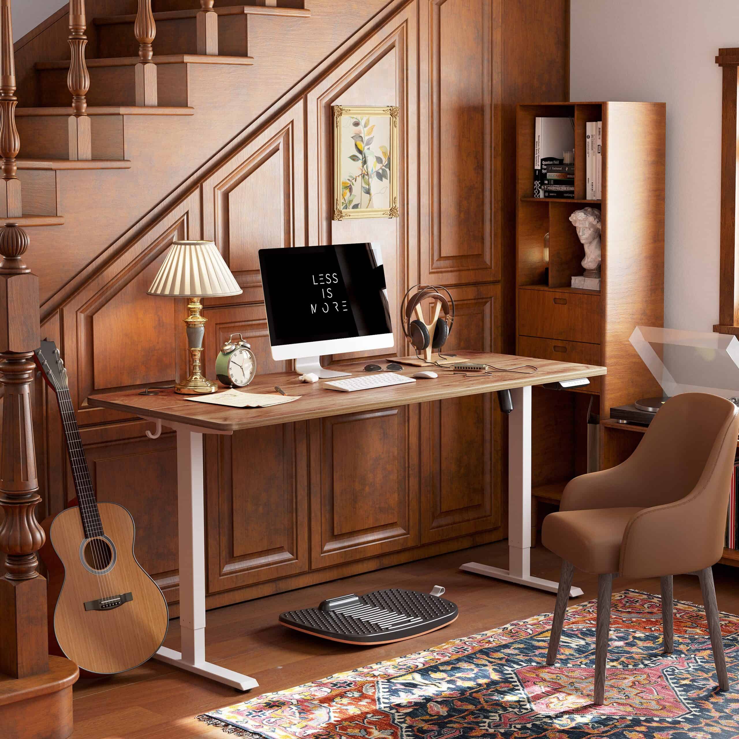 a compact desk with a computer and a guitar in a room